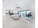 Spacious living room, white sectional sofa, and view of patio at 8459 Harvey Walden Dr, Plant City, FL 33565