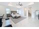 Large main bedroom with plush carpet and en-suite bathroom at 8459 Harvey Walden Dr, Plant City, FL 33565