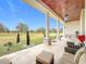Relaxing covered porch with rocking chairs and outdoor seating at 8459 Harvey Walden Dr, Plant City, FL 33565