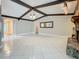 Spacious living room with tile floors and exposed beams at 9391 121St Ter, Largo, FL 33773