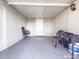 Covered back patio with access from garage at 9825 Lakeside Ln, Port Richey, FL 34668