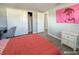 Bright bedroom with double bed and sliding door closet at 9825 Lakeside Ln, Port Richey, FL 34668