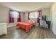 Bedroom with a queen bed, a vanity, and hardwood floors at 9825 Lakeside Ln, Port Richey, FL 34668