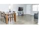 Dining area with a dark wood table and four chairs at 9825 Lakeside Ln, Port Richey, FL 34668