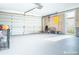 Spacious garage with ample storage space and automatic garage door opener at 9825 Lakeside Ln, Port Richey, FL 34668