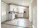 Modern kitchen with white cabinets, stainless steel appliances, and granite countertops at 9825 Lakeside Ln, Port Richey, FL 34668
