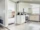 Modern kitchen with white cabinets, stainless steel appliances, and granite countertops at 9825 Lakeside Ln, Port Richey, FL 34668