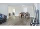 Open living room with dining area and hardwood floors at 9825 Lakeside Ln, Port Richey, FL 34668