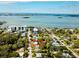 Aerial view of a residential area with a waterfront view at 1034 Sunnydale Dr, Clearwater, FL 33755