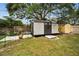 Large backyard with storage shed and privacy fence at 1034 Sunnydale Dr, Clearwater, FL 33755