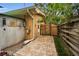 Relaxing backyard patio with brick pavers, pergola, and seating area at 1034 Sunnydale Dr, Clearwater, FL 33755