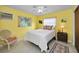 Well-lit bedroom with a ceiling fan and window at 1034 Sunnydale Dr, Clearwater, FL 33755