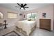 Cozy bedroom with a ceiling fan and ample closet space at 1034 Sunnydale Dr, Clearwater, FL 33755