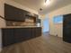 Kitchen with dark wood cabinets and granite countertops at 1106 Carlton St, Clearwater, FL 33755