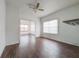 Living room with wood floors and a view into another room at 1106 Carlton St, Clearwater, FL 33755