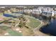 Expansive aerial view of the condo buildings surrounded by a well-maintained golf course and serene lakes at 1200 Country Club Dr # 6206, Largo, FL 33771