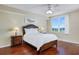 Bright bedroom featuring hardwood floors and large window at 1200 Country Club Dr # 6206, Largo, FL 33771