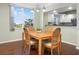 Dining area with hardwood floors and kitchen view at 1200 Country Club Dr # 6206, Largo, FL 33771