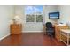 Home office with wood desk and window view at 1200 Country Club Dr # 6206, Largo, FL 33771