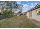 Fenced backyard with grassy area, offering privacy and outdoor space at 12413 Gunstock Ln, Hudson, FL 34667