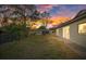 Spacious backyard with sunset view, providing ample outdoor space at 12413 Gunstock Ln, Hudson, FL 34667