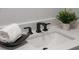 Stylish bathroom with a modern sink and black matte fixtures at 12413 Gunstock Ln, Hudson, FL 34667