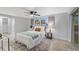 Bright bedroom with a queen-size bed and direct access to the backyard at 12413 Gunstock Ln, Hudson, FL 34667