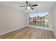 Bright bedroom with large window and wood floors at 12413 Gunstock Ln, Hudson, FL 34667