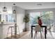 Bright dining room with sliding glass doors and modern decor at 12413 Gunstock Ln, Hudson, FL 34667