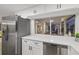 Stainless steel appliances and white shaker cabinets in this updated kitchen at 12413 Gunstock Ln, Hudson, FL 34667