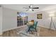 Cozy home office with a desk, chair and large window at 12413 Gunstock Ln, Hudson, FL 34667