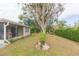 Backyard view showing mature trees and plants at 12512 River Mill Dr, Hudson, FL 34667