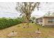 Large backyard with mature trees and landscaping at 12512 River Mill Dr, Hudson, FL 34667