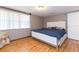 Bright bedroom with wood flooring and large window at 12512 River Mill Dr, Hudson, FL 34667