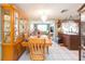 Bright dining area with a wood table and large china cabinet at 12512 River Mill Dr, Hudson, FL 34667