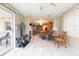 Open living room and dining area with view into the sunroom at 12512 River Mill Dr, Hudson, FL 34667