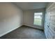 Bedroom with window, closet, and carpet flooring at 13251 Ogden Glade Rd, Dade City, FL 33525