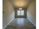 Formal dining area with chandelier and large window at 13251 Ogden Glade Rd, Dade City, FL 33525