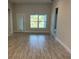 Bright and airy living room with tile floors at 13251 Ogden Glade Rd, Dade City, FL 33525