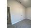 Spacious bedroom with gray carpet and neutral walls at 13287 Ogden Glade Rd, Dade City, FL 33525