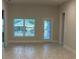 Dining room with tile flooring and access to the backyard at 13287 Ogden Glade Rd, Dade City, FL 33525