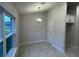 Dining area with tile floors and a chandelier at 13287 Ogden Glade Rd, Dade City, FL 33525