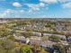 Aerial view showing townhouses, swimming pools, and landscaping at 13630 Forest Lake Dr, Largo, FL 33771