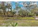 Landscaped backyard with lush greenery at 13630 Forest Lake Dr, Largo, FL 33771