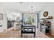 Kitchen and dining area with stainless steel appliances and breakfast bar at 13630 Forest Lake Dr, Largo, FL 33771