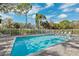 Refreshing community pool with plenty of seating at 13630 Forest Lake Dr, Largo, FL 33771