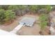 Aerial view of a single-story house with a fenced yard and driveway at 16125 Magpie Rd, Weeki Wachee, FL 34614