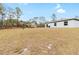 Large backyard with a view of neighboring houses at 16125 Magpie Rd, Weeki Wachee, FL 34614