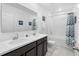 Bathroom with double sinks, bathtub, and shower at 16125 Magpie Rd, Weeki Wachee, FL 34614