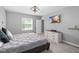 Spacious bedroom with a large bed, dresser, and TV at 16125 Magpie Rd, Weeki Wachee, FL 34614